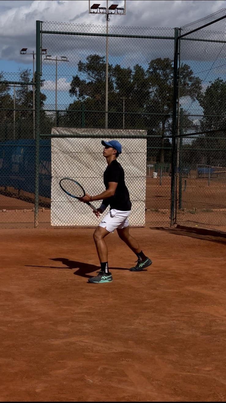 Alvaro Llambrich training on a clay tennis court