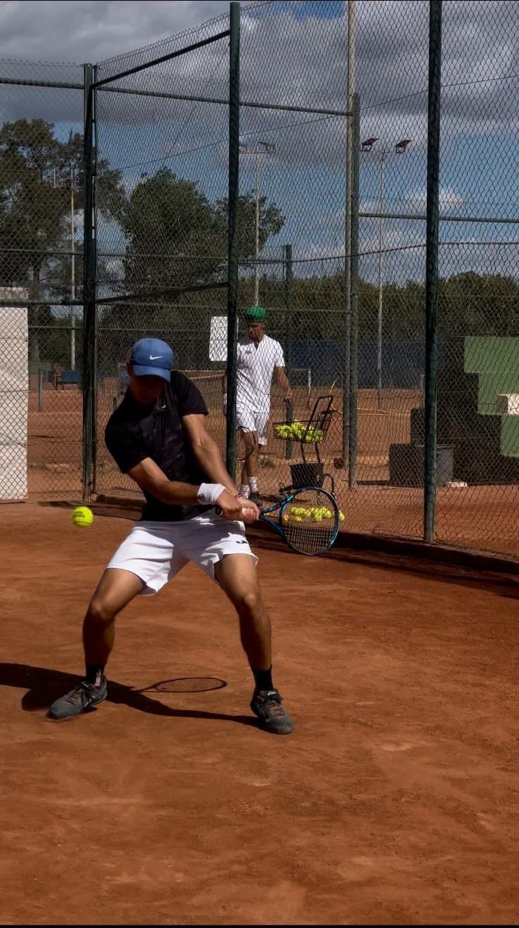 Alvaro Llambrich hitting a backhand during a training session